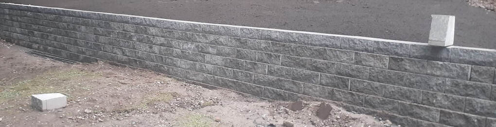 long grey retaining wall